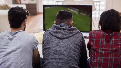 friends watching football match